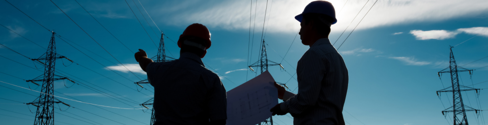 Infrastructure workers reviewing asset and capital planning data on site, highlighting the risks of spreadsheet-driven planning